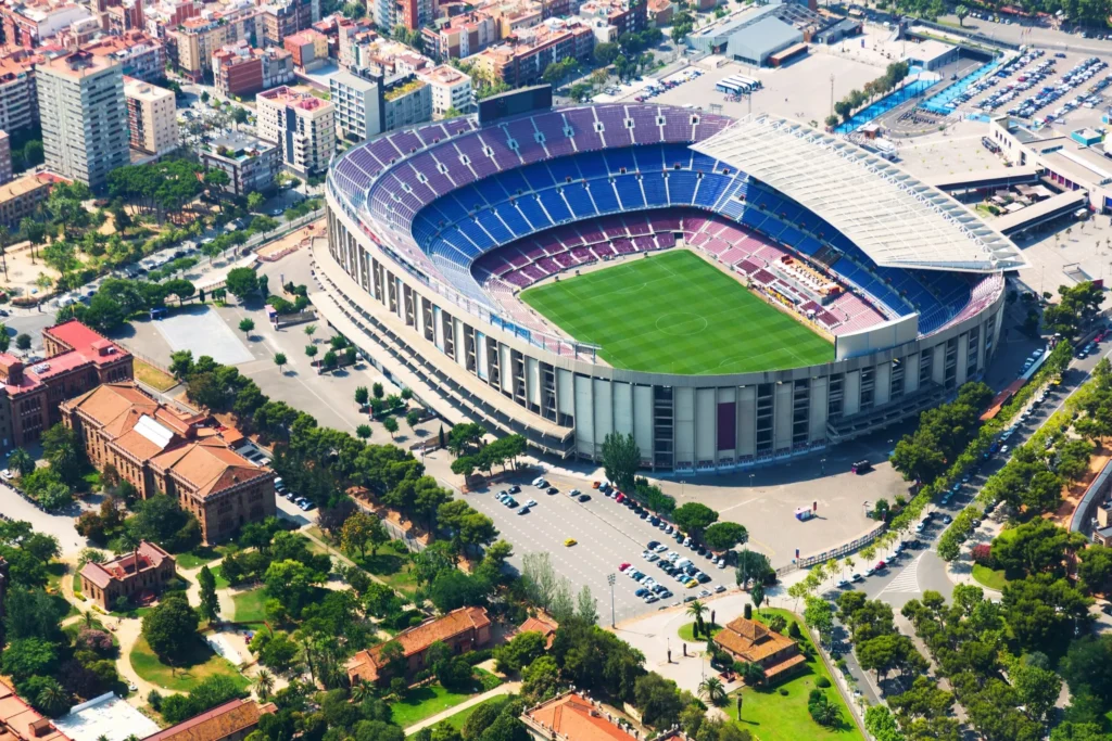 Aerial view of a large football stadium, representing communications, safety and security systems for major venues.