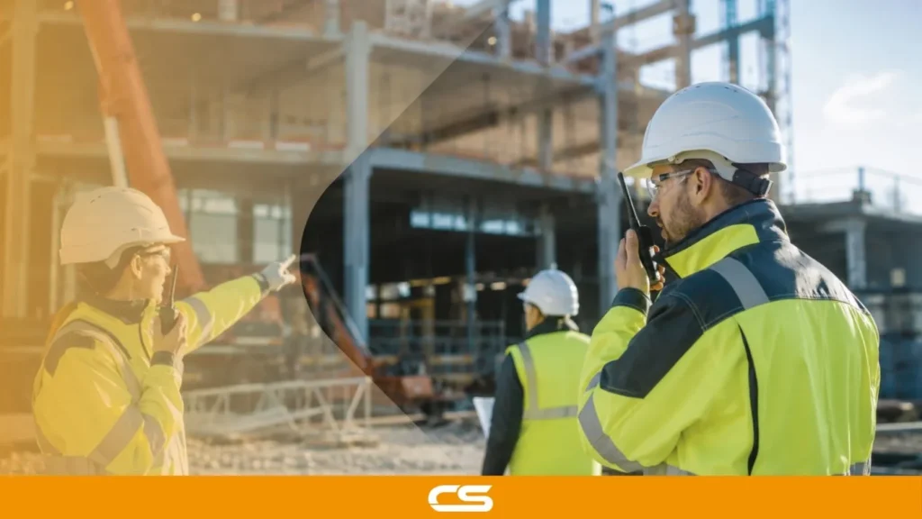 Construction workers using two-way radios on a UK site